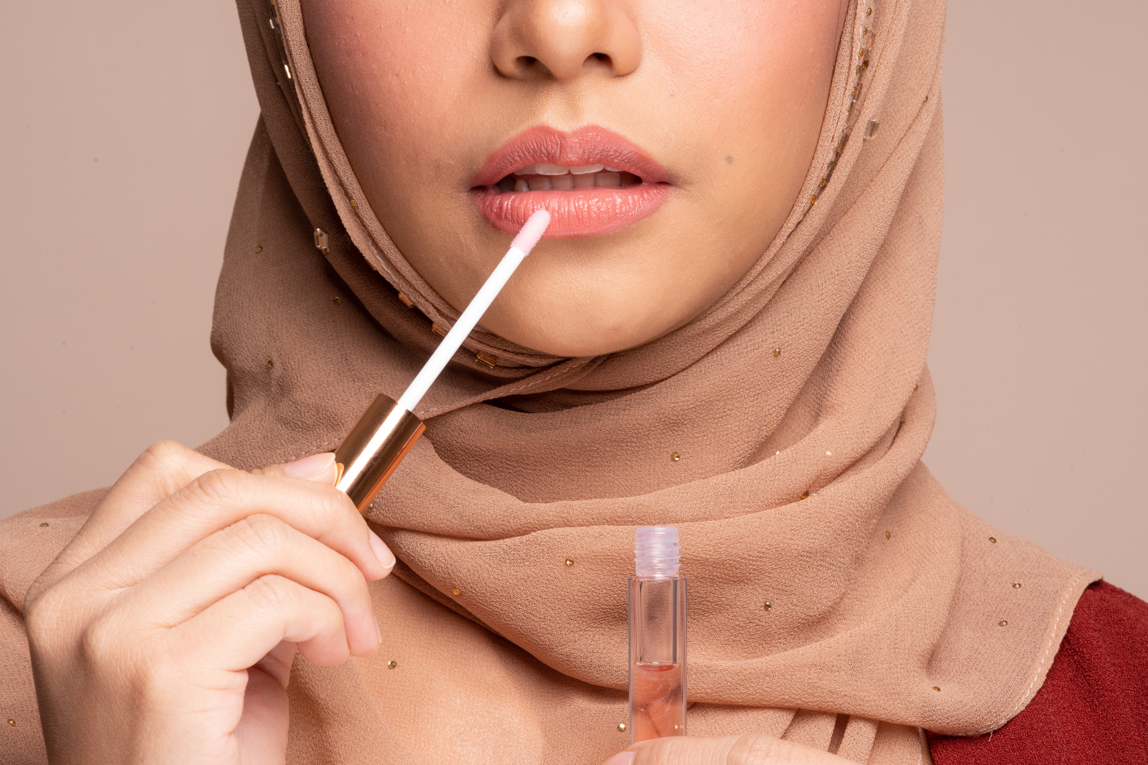 Woman Wearing Hijab and Applying Makeup